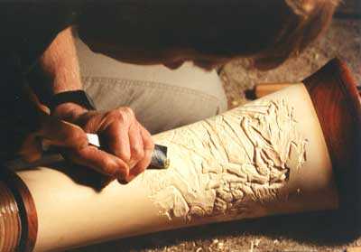 Doug carving a Koa Wood Alphorn