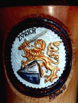 Doug Pauls' Alphorn Artwork: The Zurich Coat of Arms. The lion is in gold leaf. The sword and shield are in silver leaf.